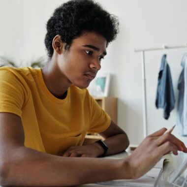 boy using tablet in bedroom