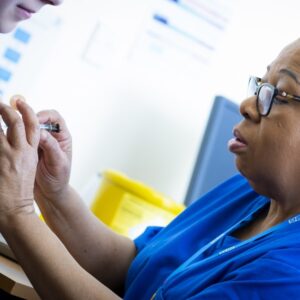 Immunisation Nurse injecting someone's arm